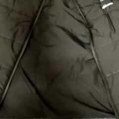 Bodywarmer Zwart, zoals gemeld door Mövenpick Hotel Amsterdam City Centre met iLost