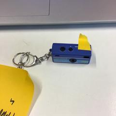 Kamera Keychain, amint azt W2 - Tomorrowland az iLost segítségével jelentette.