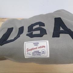 Gyermek pulóver Grijs/groene kleur met USA opdruk, amint azt IKEA Heerlen az iLost segítségével jelentette.