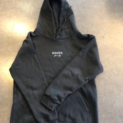 Zwarte hoodie met tekst MAKER メーカ, as reported by Awakenings ADE – Warehouse Elementenstraat 2019 using iLost