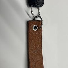 Sleutel Beige sleutelhanger KOINOR, como reportado por Stad Hasselt utilizando o iLost