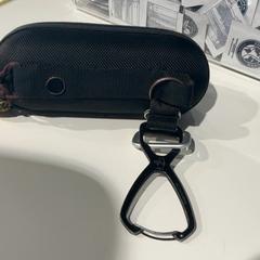 Glasses case with glasses, as reported by Cincinnati Tennis LLC using iLost