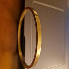 Goudkleurige armband, gerapporteerd met iLost