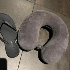 Neck pillow travel grey, and sandal (one), as reported by MEININGER Hotel Amsterdam City West using iLost