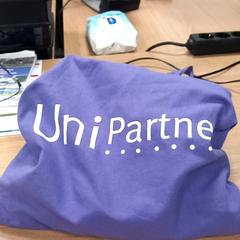 Väska Paars met opdruk Unipartners, rapporterat av RRReis Veluwe Zuid - Ede med iLost