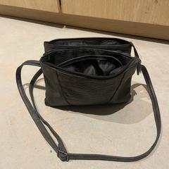 Zwarte tas van Unique, ha sido reportado a iLost