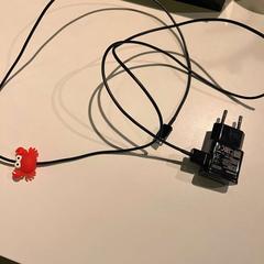 Adapter BLACK CHARGER, som rapportert av Room Mate Bruno ved bruk av iLost