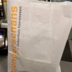 Tas papier wit, come riportato da Qbuzz GD Groningen HS utilizzando iLost