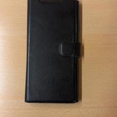 Smartphone Zwart hoesje, come riportato da HTM utilizzando iLost