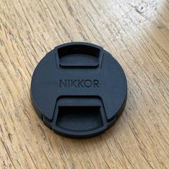 غطاء العدسة Zwart Nikkor lenskapje، كما تم الإبلاغ عنه بواسطة Hortus عبر iLost
