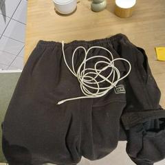 Shorts and charging cable, as reported by Conscious Hotel Westerpark using iLost