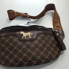 Bolsa - Heuptasje bruin, ha sido reportado por Centraal magazijn con iLost