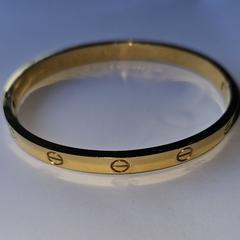 Armband goudkleurig, come riportato a iLost