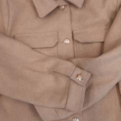 Casaco de mulher, como reportado por Rotterdam The Hague Airport utilizando o iLost