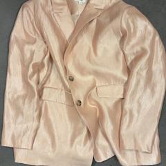 Jaqueta de vestit Zalm roze glitter, segons ha informat Koninklijk Theater Carré mitjançant iLost