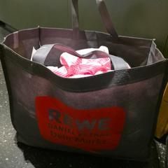 Bag grey fabric Bag with REWE Logo, as reported by MEININGER Hotel Bremen Hauptbahnhof using iLost
