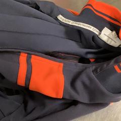 Jacket Black with red lines, as reported by MEININGER Hotel Copenhagen using iLost
