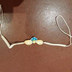 Armband corde et coquillages, rapporterat av TCL med iLost