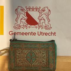 Groen bewerkt portomonnee, zoals gemeld door Gemeente Utrecht met iLost