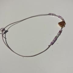 Armband Paars en witte kralen, rapporterat av IKEA Groningen med iLost