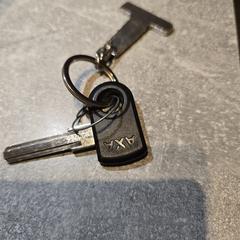 Fietssleutel AXA met sleutelhanger, as reported to iLost