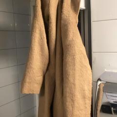 Kabátok Brown, amint azt MEININGER Hotel Copenhagen az iLost segítségével jelentette.