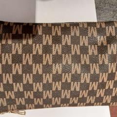 Pochette marron, a été signalé par TCL utilisant iLost