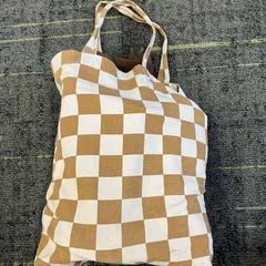 Bag Katoen, wit / bruin geblokt, as reported by Connexxion Noord Holland Noord Alkmaar using iLost