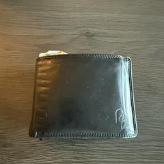 Zwarte portemonne an iLost gemeldet