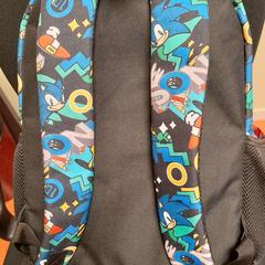 Saco noir avec motifs, como reportado por TCL utilizando o iLost