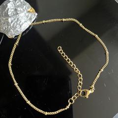 Gouden armband met bedel, come riportato a iLost