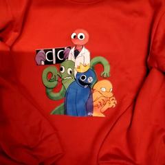 Suéter Rode trui met figuurtjes, ha sido reportado por Gemeente Puurs-Sint-Amands con iLost