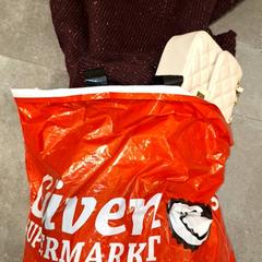 Tasje kleding, como reportado por Qbuzz DMG utilizando o iLost