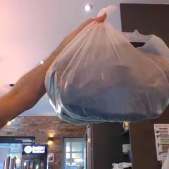 Bag full with clothes red Jacket and a pants, som rapportert av MEININGER Hotel Hamburg City Center ved bruk av iLost