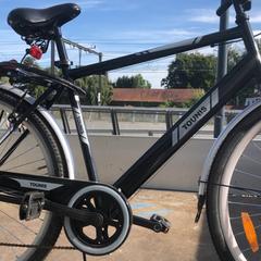 Herrcykel Zwart merk Tounis, rapporterat av Fietsdepot Diepenbeek med iLost