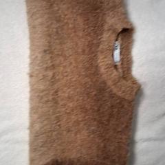 En trui, som rapportert av Grand Hotel Amrâth Amsterdam ved bruk av iLost