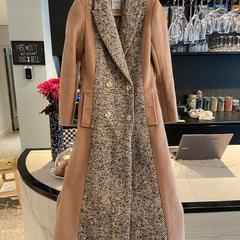 Coat, come riportato da Conscious Hotel Museum Square utilizzando iLost