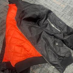 Jacket Zwart oranje binnenkant, as reported by Connexxion Amstelland-Meerlanden Schiphol Noord using iLost