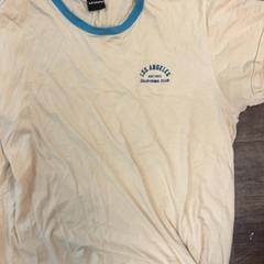 Tshirt, como reportado por Inntel Hotels Amsterdam Centre utilizando o iLost