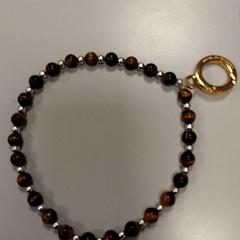 Braccialetto Kralen bruin, come riportato da Vrije Universiteit Amsterdam utilizzando iLost