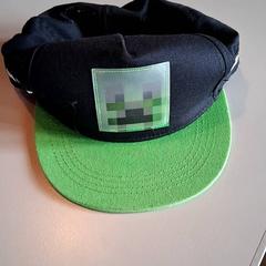Casquette Zwart met groen, as reported by Familiepark Drievliet using iLost