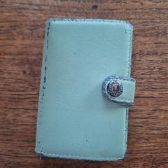 Groene secrid portemonnee, jak bylo nahlášeno na iLost