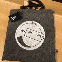 Draagtas Stoffen grijze draagtas, som rapportert av Stad Hasselt ved bruk av iLost