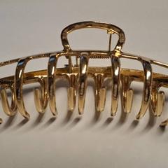 Clip de pelo van goudkleurig metaal, geen merk, segundo informou TheaterHangaar usando iLost