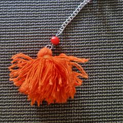 Sleutel met een oranje kwastje., segons s'ha informat a iLost