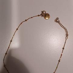 Collar dorado, gisa salatu by RÍO Shopping - Valladolid iLost erabiliz