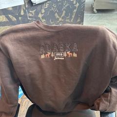 Vestiario Bruine trui met figuur, come riportato da Haven Hotel Rotterdam utilizzando iLost