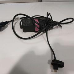 Adaptador roze tape om stroomblok heen, segundo informou Cursus en vergadercentrum Domstad usando iLost