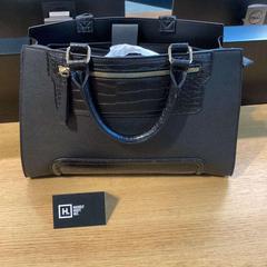 Handtas zwart, come riportato da Stad Hasselt utilizzando iLost