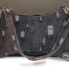 Handtasje, ha sido reportado por Gemeente Hilversum con iLost